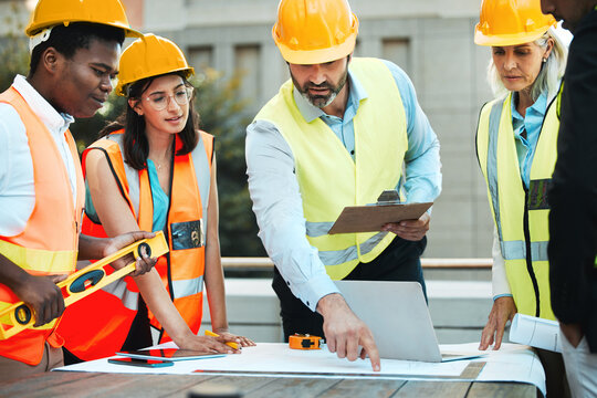 Outdoor, architects and meeting with blueprint on rooftop for planning a building design, layout and project. Table, construction and engineering people with ideas for renovations and maintenance