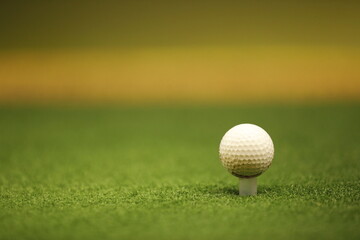 Golf ball on tee ready to be shot