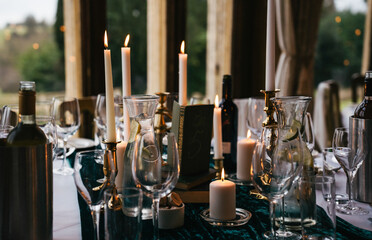 candles at a wedding reception dinner table