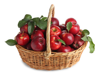 Fresh ripe red apples with green leaves in wicker basket isolated on white