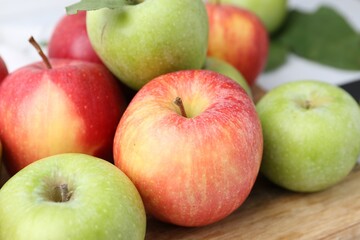 Many fresh ripe apples on table, closeup