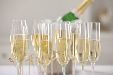 Champagne in glasses on blurred background, closeup