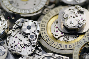 Old mechanical watches with gears and cogs. Watch or clock mechanisms