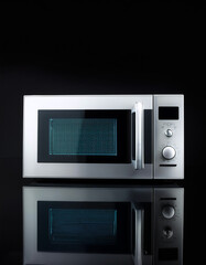 Obraz premium microwave, isolated on a dark black