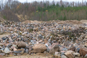 Boulders in a sand quarry. Pile of Rocks Boulders for Construction