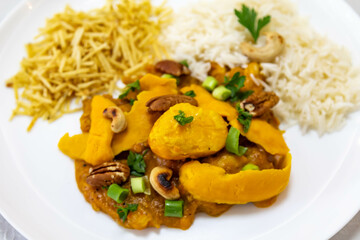 Traditional and exotic Brazilian dish rice, chicken and pequi (caryocar brasileinse) 
