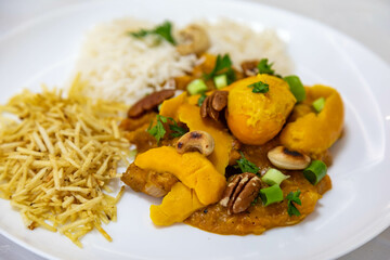 Traditional and exotic Brazilian dish rice, chicken and pequi (caryocar brasileinse) 