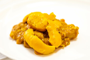 Traditional and exotic Brazilian dish rice, chicken and pequi (caryocar brasileinse) 