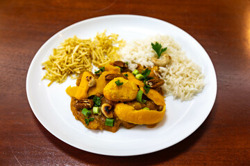 Traditional and exotic Brazilian dish rice, chicken and pequi (caryocar brasileinse) 