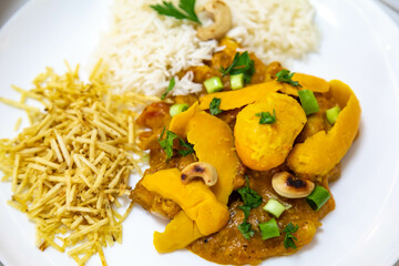 Traditional and exotic Brazilian dish rice, chicken and pequi (caryocar brasileinse) 