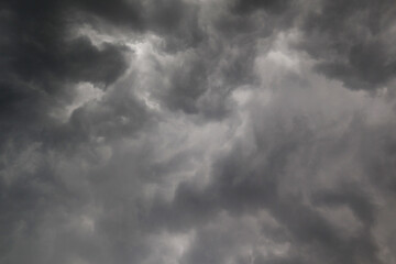 Fototapeta premium Dramatic dark cloudy sky before rain and storm, rainy sky black clouds nature background