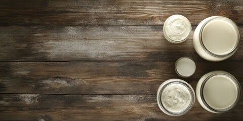 Fototapeta premium Jars of Cream and Milk on Rustic Wooden Background