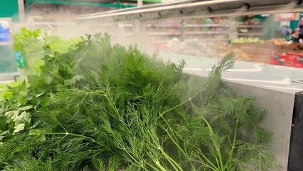 Grocery store displays fresh herbs with a light mist for added freshness and appeal