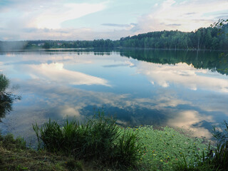 Landscape with lake and forest in the evening. Beautiful nature.