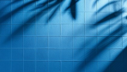 Obraz premium blue paper checkered texture background with leaves shadows copy space