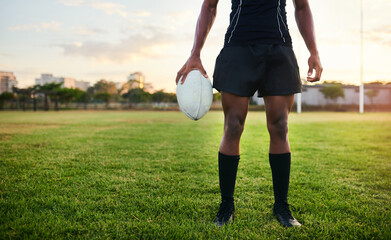 Man, legs and rugby with ball for outdoor, game or challenge in exercise, wellness and fitness. Male person, athlete and recreation facility as team for match, sports and training in stadium or arena