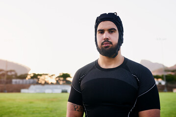 Man, rugby and portrait for outdoor, game or challenge with exercise, wellness or fitness. Male person, athlete and recreation facility in scrum cap for match, sport and training in stadium as player
