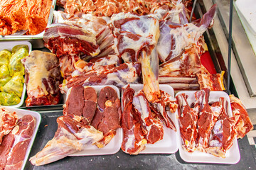 Traditional Butcher's Shop Selling High-Quality Meats and Cuts with Freshness Guarantee.