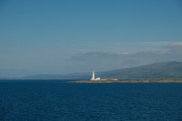 lighthouse on the scottish seafront, isle of mull iona