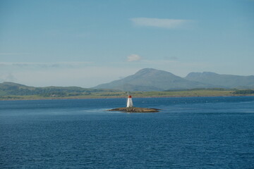 lighthouse on the scottish seafront, isle of mull iona