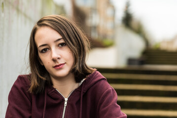 Outdoor portrait of a white 17 yo girl in Molenbeek, Brussels, Belgium