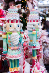Selective focus vertical view of beautiful Christmas giant pastel nutcracker soldiers