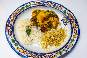 Gourmet and exotic Brazilian dish rice, chicken and pequi (caryocar brasileinse) 
