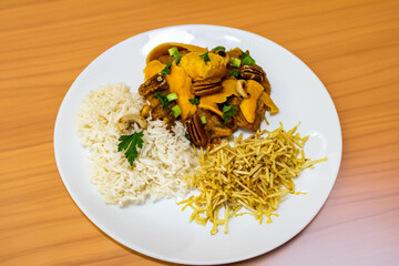 Gourmet and exotic Brazilian dish rice, chicken and pequi (caryocar brasileinse) 