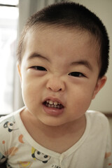 Little asian boy smiling and look at camera