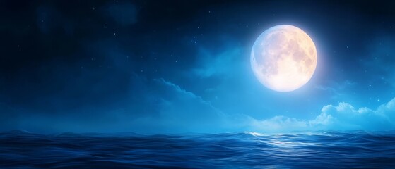 A full moon over the ocean at night