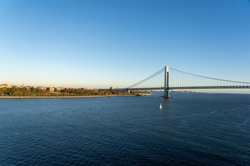 Drone view of Verrazzano-Narrows Bridge over blue waters in New York, USA