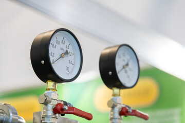 Close-up view of group of pressure gauges of milk pasteurization and cooling machine turned off....