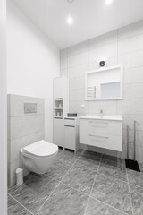 Bright Elegant Modern Luxury Home Bathroom Interior Design With White Sink. Marble Gray Walls, Mirror and Faucet. LED Lights. Shower Area, Heater, Tile Floor and Walls