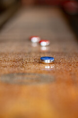 Playing a game of shuffleboard.