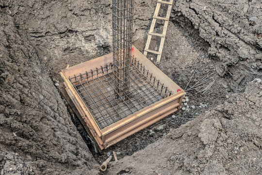 Formwork with reinforcement bar for pad footing. Construction of pad footing foundation where the pads are used to support columns or structural framework within the superstructure.