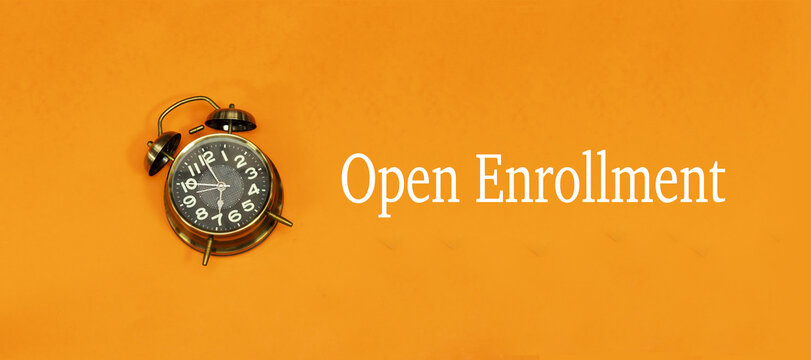 open enrollment concept with alarm clock, time to registration
