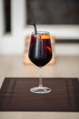 A glass of fresh delicious sangria on the table in the restaurant