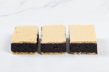 Energy food. Waffles with prunes. Close-up.  White bacckground