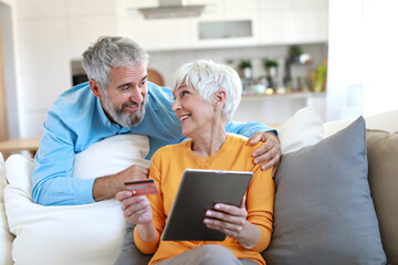 couple credit woman tablet shopping card online senior elderly retirement adult old retired mature senior couple pensioner older active two aged vitality online shopping finace buying bill