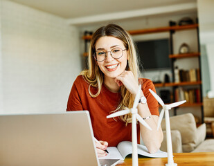 laptop computer girl woman home female internet young office business student  windmill energy...