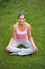 Happy woman, outdoor and lotus in yoga for portrait, meditation or peace in garden. Mature fitness person, zen and smile on grass for spiritual healing, positive mental health or calm to align chakra