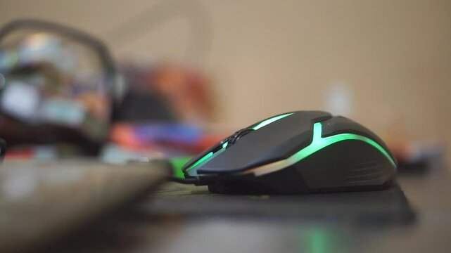 gaming mouse lights up in different colors on black table
