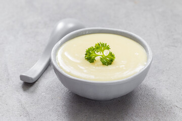Children Potato soup puree in a bowl. With parsley. Close-up. 