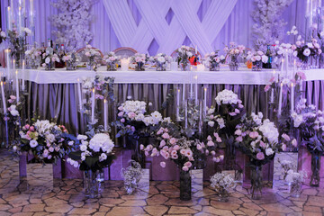 Elegant wedding table setting with floral decor.