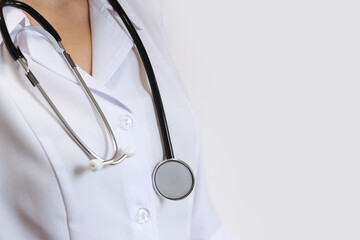 Doctor or nurse with stethoscope. Medicine and health concept. Pediatrician in white coat with stethoscope. Woman, medical and cardiac monitoring instrument, white background. Treatment instrument