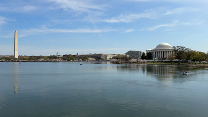 Washington DC, USA, March 30, 2024: The Washington Monument and the Thomas Jefferson Memorial, as seen from West Potomac Park across the Tidal Basin in Washington, D.C, USA.