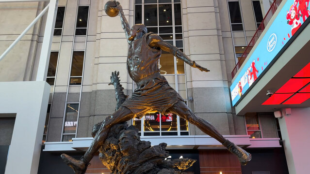 Chicago, Illinois, USA, March 27, 2024: The Michael Jordan Statue, also known as The Spirit, is a bronze sculpture by Omri Amrany and Julie Rotblatt-Amrany inside the United Center.