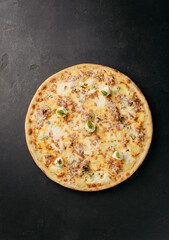 Classic Italian pizza with a golden cheese topping and herbs, ready to enjoy
