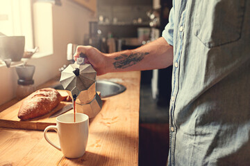 Home, kitchen and hands of person with coffee in moka pot for caffeine beverage, warm drink and cappuccino. Apartment, morning and man with espresso maker on counter for breakfast, aroma and wellness