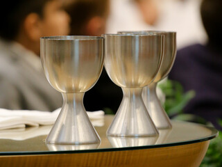 Catholic Church Eucharistic wine chalices glasses on altar